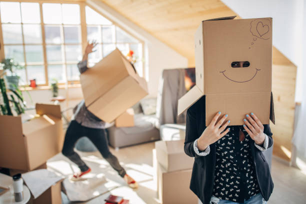 istock Playful couple moving in into new apartment 1138691186