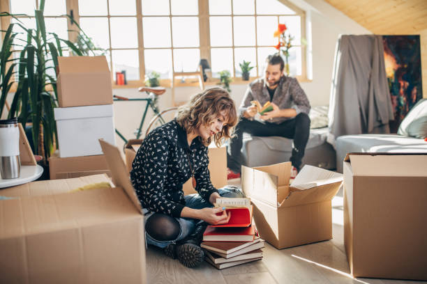 istock Happy couple moving in into new house 1138691220