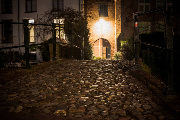 istock medieval city gate with old pavement and atmospheric lighting. 1138692709