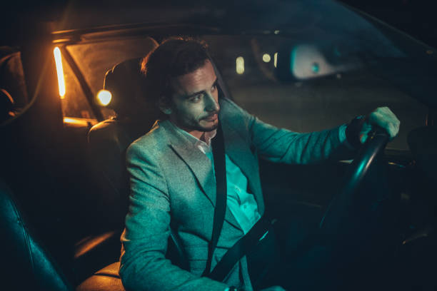 istock Man Driving A Car In Night 1138693108