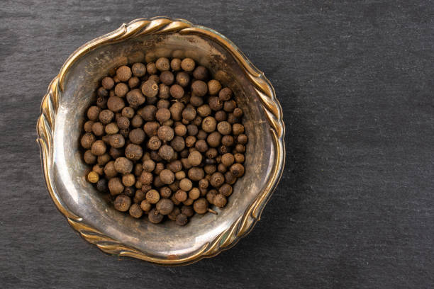 istock Dry allspice berries on grey stone 1138693201