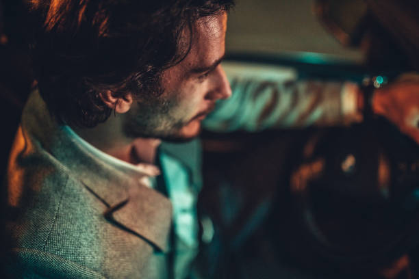 istock Man Driving A Car In Night 1138693223