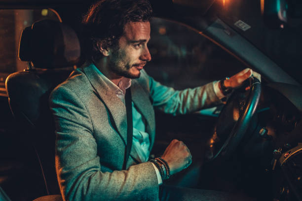 istock Man Driving A Car In Night 1138693890
