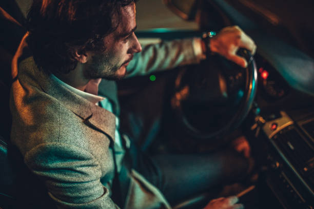 istock Man Driving A Car In Night 1138694550