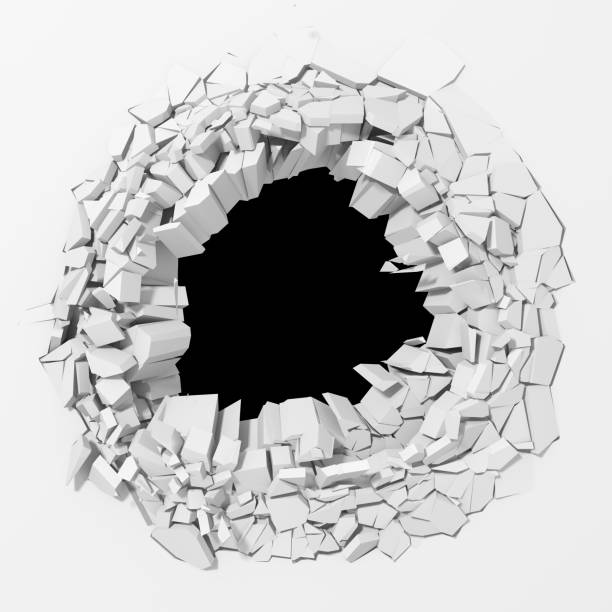 istock Dark cracked broken hole in concrete wall 1138695596