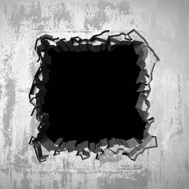 istock Dark cracked broken hole in concrete wall 1138695701