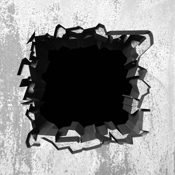 istock Dark cracked broken hole in concrete wall 1138695744