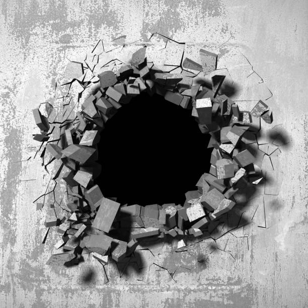 istock Dark cracked broken hole in concrete wall 1138695781