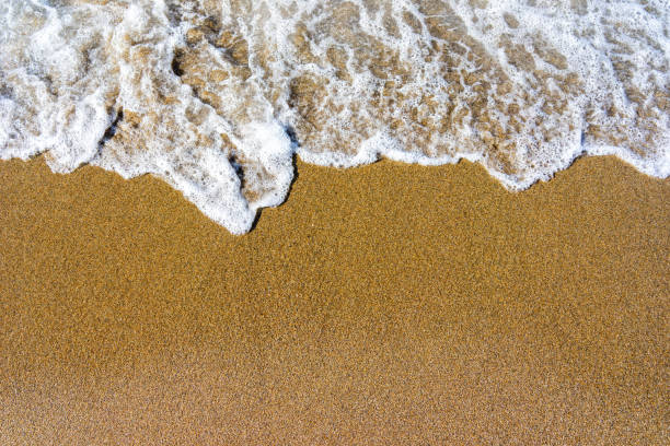 istock Soft wave of blue sea on sandy beach. 1138696215