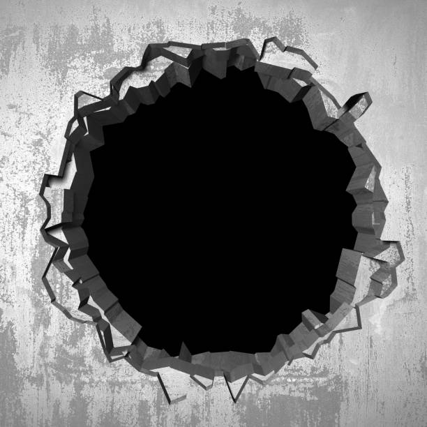 istock Dark cracked broken hole in concrete wall 1138696353