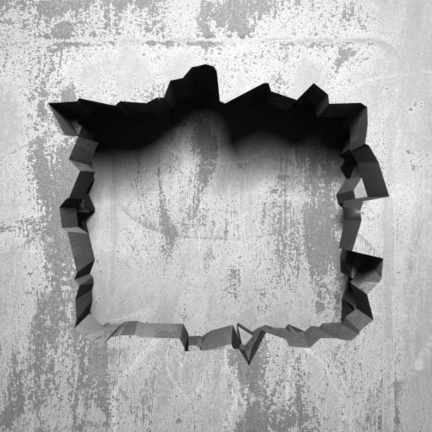istock Dark cracked broken hole in concrete wall 1138696813