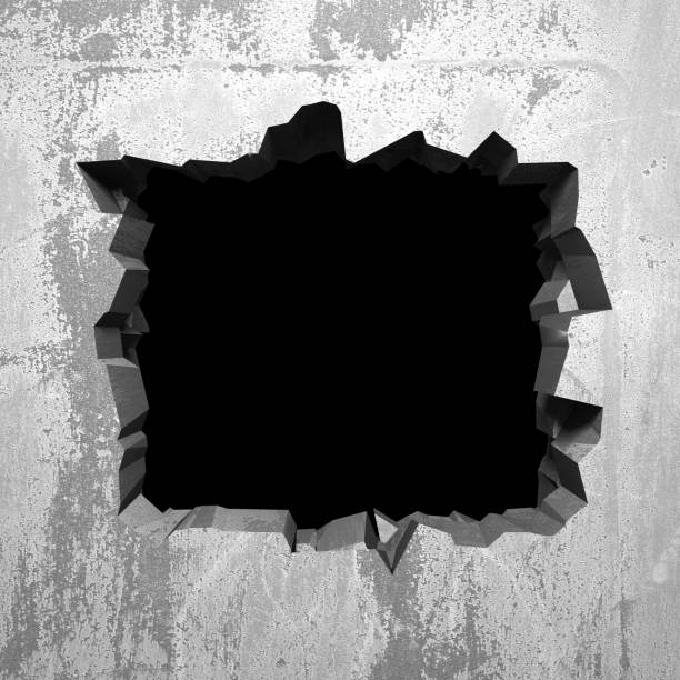 istock Dark cracked broken hole in concrete wall 1138696935