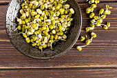 Mungo bean sprouts on brown wood