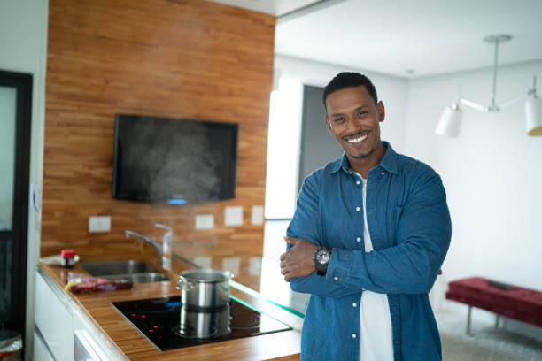 istock Latin man portrait smiling at home 1138697935