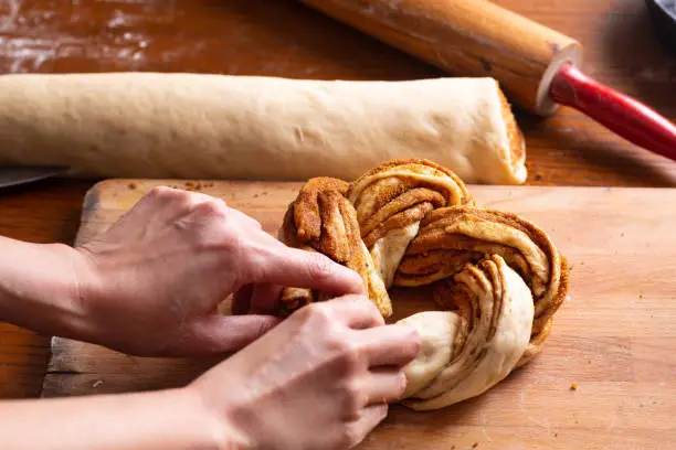 Food bakery concept making bread dought for Cinnamon Roll Braided Bread with copy space