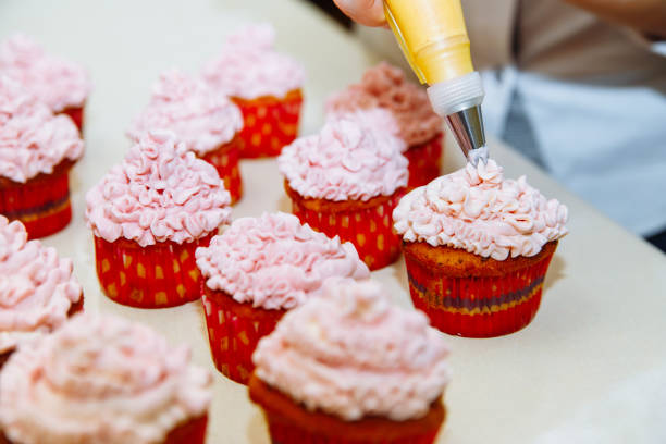 istock Cooking cupcakes at home. Pink Cream Baking Decoration 1138699276