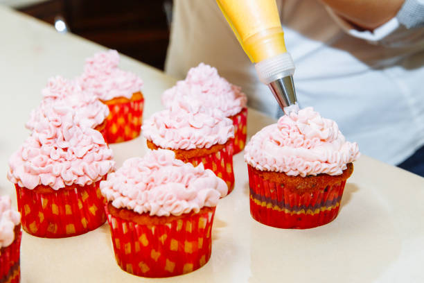 istock Cooking cupcakes at home. Pink Cream Baking Decoration 1138699338