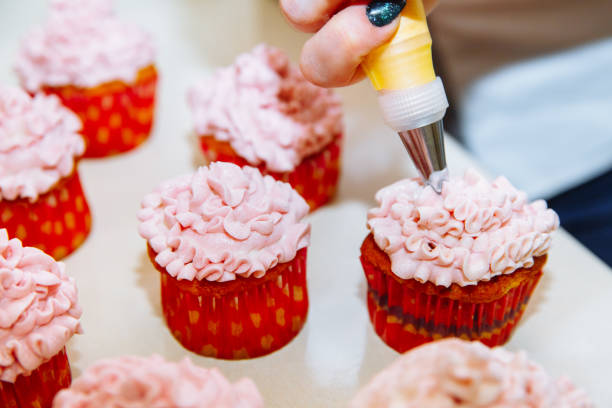 istock Cooking cupcakes at home. Pink Cream Baking Decoration 1138699388