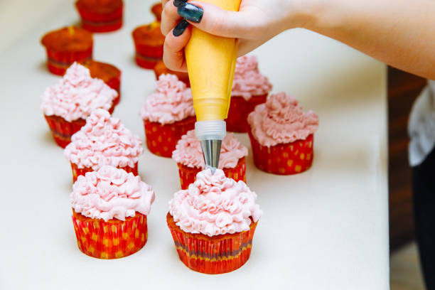 istock Cooking cupcakes at home. Pink Cream Baking Decoration 1138699419