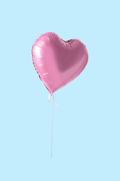 istock Pink heart shaped balloon on bright background. Minimal love concept. 1138701765