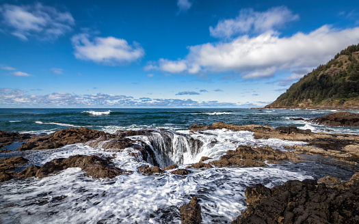 A stormy day at Thor's Well, central Oregon, USA. Color Image.