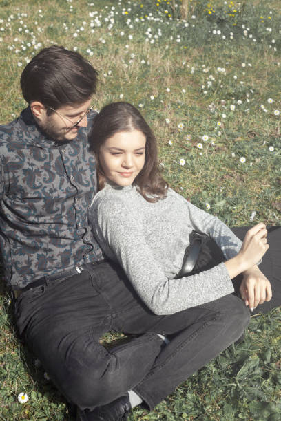 istock happy couple in the park in sunny day 1138704549