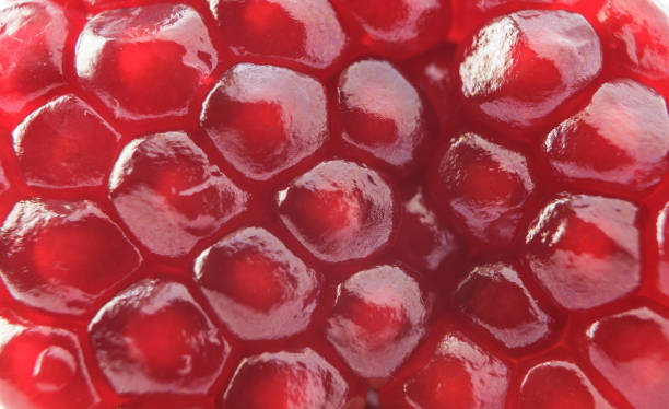 istock Delicious red ripe juicy pomegranate background texture. 1138707526