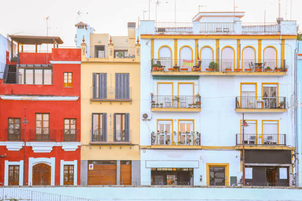 Famous Betis street in Triana district of Seville with Guadalquivir river at the foot