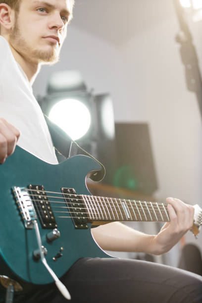 istock Man playing on electric guitar 1138707625