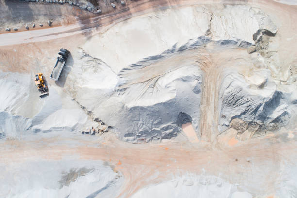 Large gravel and quartzite quarry - aerial view Large gravel and quartzite quarry - aerial view sand mine stock pictures, royalty-free photos & images