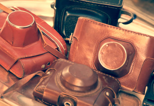 Old leather cases from cameras, brown and black, toned