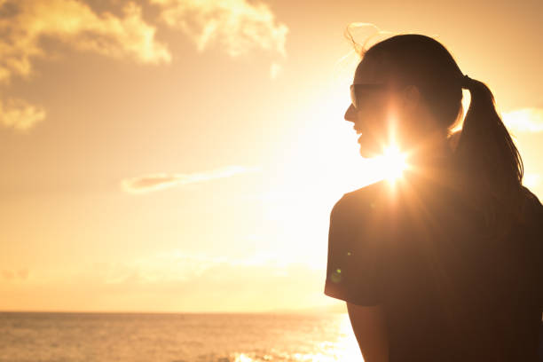 istock Woman enjoying the sunset 1138709643