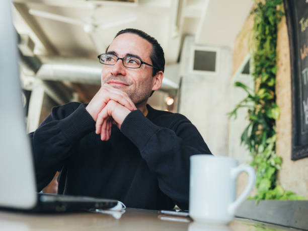 istock Caucasian man having a break at the small bistro 1138710371