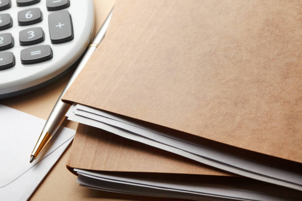 istock Ballpoint Pen Next To A Stack Of File Folders And A Calculator 1138711010