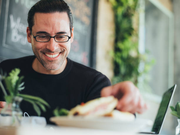 istock Caucasian man having a break at the small bistro 1138711221