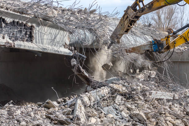istock Professional demolition of reinforced concrete structures using industrial hydraulic hammer. Rods of metal fittings. Wreckage and crumbles of concrete. 1138716139