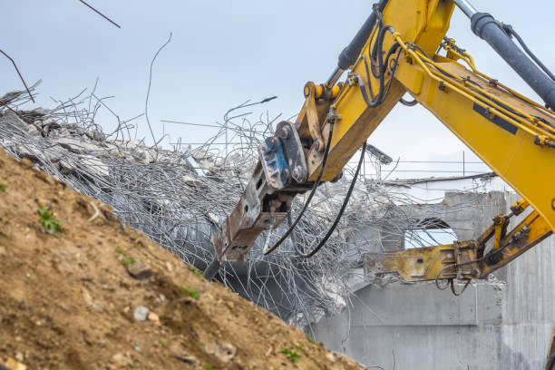 istock Professional demolition of reinforced concrete structures using industrial hydraulic hammer. Rods of metal fittings. Wreckage and crumbles of concrete. 1138716180