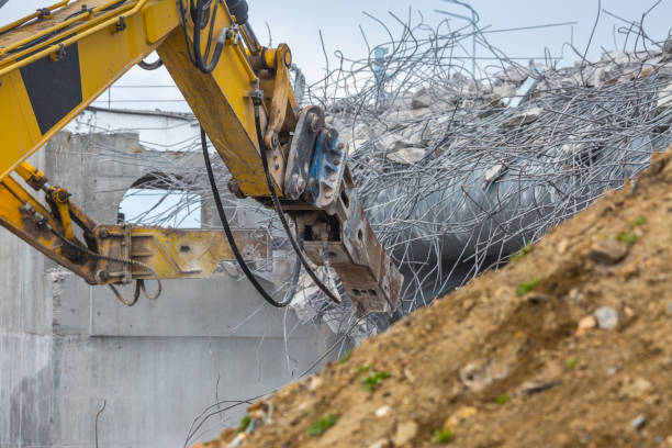 istock Professional demolition of reinforced concrete structures using industrial hydraulic hammer. Rods of metal fittings. Wreckage and crumbles of concrete. 1138716212