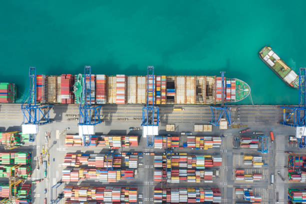 istock Aerial top view container cargo ship working. Business import export logistic and transportation of International by ship in the open sea. 1138716794