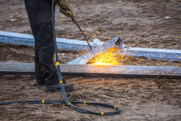 istock A worker cut steel beams using propane-oxygen torch.