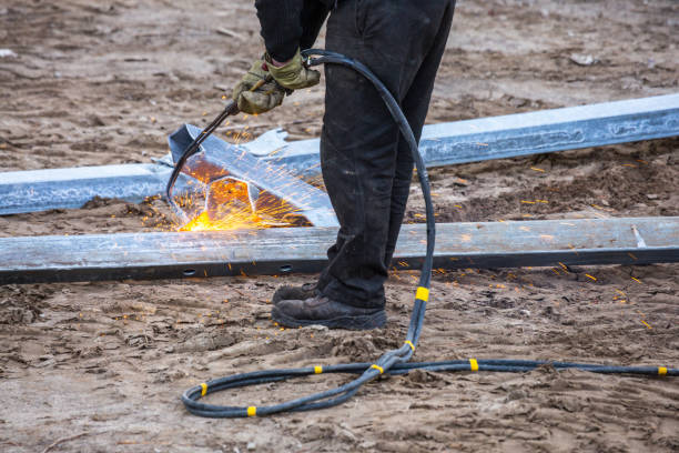 istock A worker cut steel beams using propane-oxygen torch.