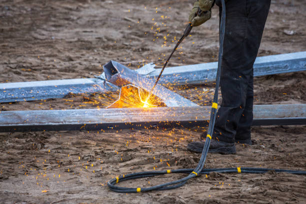 istock A worker cut steel beams using propane-oxygen torch.