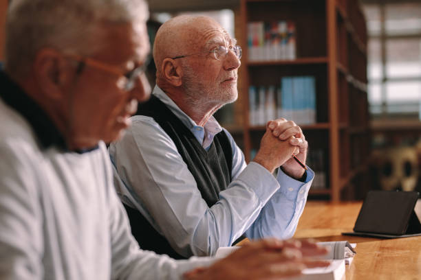 istock Senior men sitting in a classroom learning 1138717047