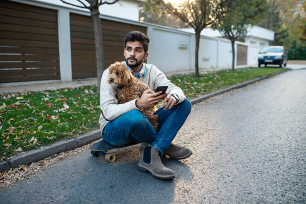 istock Skater Having a Break With His Dog 1138719716