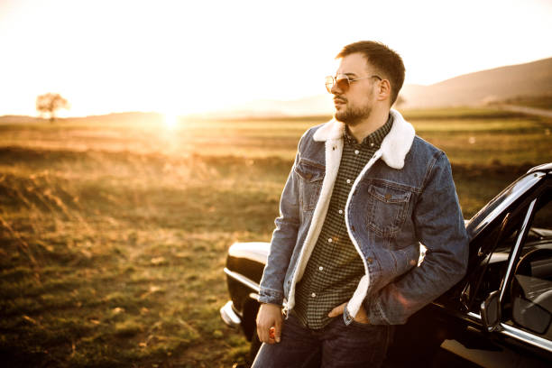 istock Young good-looking man leaning on car 1138720727