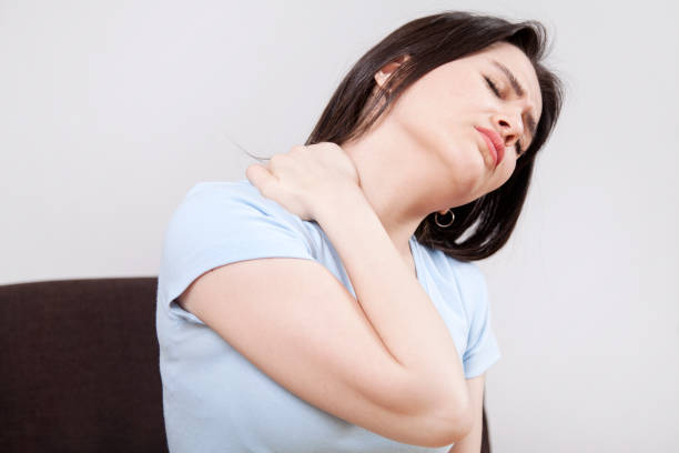 istock Young woman with neck pain 1138720976
