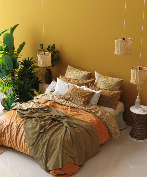 istock Bedroom interior in Bohemian style with patterned bed and floral corner 1138721820