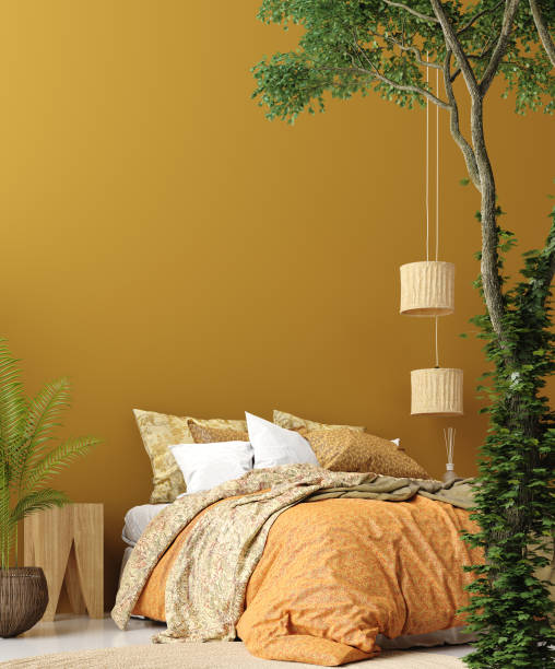 istock Bedroom interior in Bohemian style with patterned bed and floral corner 1138721830
