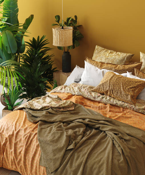 istock Bedroom interior in Bohemian style with patterned bed and floral corner 1138721835