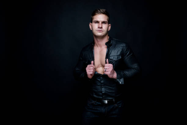 istock Attractive muscular man wearing black 1138721933